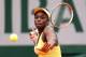PARIS, FRANCE - MAY 27: Sloane Stephens of the United States returns a shot during her women's singles match against Shuai Peng of China on day three of the French Open at Roland Garros on May 27, 2014 in Paris, France. (Photo by Matthew Stockman/Getty