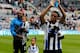 NEWCASTLE, ENGLAND- May 03: Loic Remy (R) and Shola Ameobi (L) of Newcastle during a lap of honour after the Barclays Premier League match between Newcastle United and Cardiff City at St. James' Park on May 03, 2014 in Newcastle upon Tyne, England. (Ph