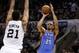 May 19, 2014; San Antonio, TX, USA; Oklahoma City Thunder guard Thabo Sefolosha (25) shoots the ball over San Antonio Spurs forward Tim Duncan (21) in game one of the Western Conference Finals in the 2014 NBA Playoffs at AT&T Center. Mandatory Credit: Soo