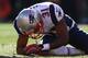 DENVER, CO - JANUARY 19: Aqib Talib #31 of the New England Patriots kneels over on the ground after colliding with Wes Welker #83 of the Denver Broncos during the AFC Championship game at Sports Authority Field at Mile High on January 19, 2014 in Denver,