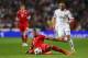 MADRID, SPAIN - APRIL 23: Jerome Boateng of Bayern Muenchen slides to clear the ball during the UEFA Champions League semi-final first leg match between Real Madrid and FC Bayern Muenchen at the Estadio Santiago Bernabeu on April 23, 2014 in Madrid, Spain