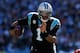 CHARLOTTE, NC - JANUARY 12: Cam Newton #1 of the Carolina Panthers runs with the ball in the second quarter against the San Francisco 49ers during the NFC Divisional Playoff Game at Bank of America Stadium on January 12, 2014 in Charlotte, North Carolina.
