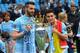 MANCHESTER, ENGLAND - MAY 11: Alvaro Negredo of Manchester City and Jesus Navas (R) pose with the trophy at the end of the Barclays Premier League match between Manchester City and West Ham United at the Etihad Stadium on May 11, 2014 in Manchester, Engl
