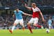 MANCHESTER, ENGLAND - MARCH 22: Alvaro Negredo of Manchester City and Brede Hangeland of Fulham compete for the ball during the Barclays Premier League match between Manchester City and Fulham at Etihad Stadium on March 22, 2014 in Manchester, England. (