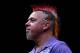 DUBAI, UNITED ARAB EMIRATES - MAY 30: Peter Wright of England celebrates after defeating Dave Chisnall of England during the 2014 Dubai Duty Free Darts Masters Semi-Final match at Dubai Duty Free Tennis Stadium, Irish Village on May 30, 2014 in Dubai, Un