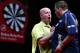 DUBAI, UNITED ARAB EMIRATES - MAY 30: Michael Van Grewen (L) of the Netherlands is congraulated by Adrian Lewis (R) of England after winning the 2014 Dubai Duty Free Darts Masters Semi-Final match at Dubai Duty Free Tennis Stadium, Irish Village on May 3