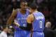 May 29, 2014; San Antonio, TX, USA; Oklahoma City Thunder forward Serge Ibaka (9) speaks with guard Russell Westbrook (0) against the San Antonio Spurs during the first half in game five of the Western Conference Finals of the 2014 NBA Playoffs at AT&T Ce