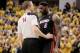May 28, 2014; Indianapolis, IN, USA; Game referee Ed Malloy (14) and Miami Heat forward LeBron James (6) exchange words during the fourth quarter in game five against the Indiana Pacers of the Eastern Conference Finals of the 2014 NBA Playoffs at Bankers