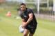 NORTHAMPTON, ENGLAND - MAY 20: Luther Burrell runs with the ball during the Northampton Saints training session held at Franklin's Gardens on May 20, 2014 in Northampton, England. (Photo by David Rogers/Getty Images)