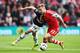 SOUTHAMPTON, ENGLAND - MAY 11: (L-R) Adnan Januzaj of Manchester United and Luke Shaw of Southampton challenge for the ball during the Barclays Premier League match between Southampton and Manchester United at St Mary's Stadium on May 11, 2014 in Southam