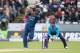 CHESTER-LE-STREET, ENGLAND - MAY 25: Kumar Sangakkara of Sri Lanka hits out with Jos Buttler of England looking on during the 2nd Royal London One Day International match between England and Sri Lanka at The Riverside on May 25, 2014 in Chester-le-Street