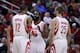 Jan 16, 2014; Houston, TX, USA; Houston Rockets shooting guard James Harden (13) speaks with power forward Dwight Howard (12) and small forward Chandler Parsons (25) during the first quarter against the Oklahoma City Thunder at Toyota Center. Mandatory Cr