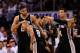OKLAHOMA CITY, OK - MAY 31: Tim Duncan #21, Patty Mills #8 and Danny Green #4 of the San Antonio Spurs celebrate a play against the Oklahoma City Thunder in the second half during Game Six of the Western Conference Finals of the 2014 NBA Playoffs at Ches