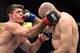 May 31, 2014; Sao Paulo, SP, BRAZIL; Paulo Thiago (red gloves) fights against Gasan Umalatov (blue gloves) during the TUF Brazil 3 Finale at Ibirapuera Gymnasium. Mandatory Credit: Jason Silva-USA TODAY Sports
