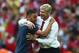 LONDON, ENGLAND - MAY 17: Alex Oxlade-Chamberlain of Arsenal and Arsene Wenger manager of Arsenal celebrate victory after the FA Cup with Budweiser Final match between Arsenal and Hull City at Wembley Stadium on May 17, 2014 in London, England. (Photo b
