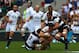 LONDON, ENGLAND - JUNE 01: Dave Ewers of England is tackled by Alexandre Lapandry of the Barbarians (L) during the Rugby Union International Match between England and The Barbarians at Twickenham Stadium on June 1, 2014 in London, England (Photo by Matt