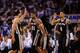 OKLAHOMA CITY, OK - MAY 31: Manu Ginobili #20 and Danny Green #4 of the San Antonio Spurs celebrate with their teammates after a play against the Oklahoma City Thunder in the second half during Game Six of the Western Conference Finals of the 2014 NBA P