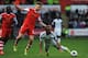 SWANSEA, WALES - MAY 03: Wayne Routledge of Swansea City takes on Luke Shaw and Victor Wanyama of Southampton during the Barclays Premier League match between Swansea City and Southampton at Liberty Stadium on May 3, 2014 in Swansea, Wales. (Photo by St