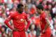 LIVERPOOL, ENGLAND - MARCH 30: Luis Suarez (R) and Daniel Sturridge of Liverpool prepare to kick off during the Barclays Premier League match between Liverpool and Tottenham Hotspur at Anfield on March 30, 2014 in Liverpool, England. (Photo by Alex Live