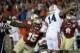 Jan 6, 2014; Pasadena, CA, USA; Florida State Seminoles defensive end Mario Edwards Jr. (15) tries to sack Auburn Tigers quarterback Nick Marshall (14) during the first half of the 2014 BCS National Championship game at the Rose Bowl. Mandatory Credit: R