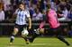 Nov 18, 2013; St. Louis, MO, USA; Argentina forward Sergio Ag ero (10) shoots the ball against Bosnia and Herzegovina goal keeper Asmir Begovic (1) during the first half at Busch Stadium. Mandatory Credit: Jasen Vinlove-USA TODAY Sports