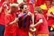 MADRID, SPAIN - JULY 12: Pepe Reina (L) and Carles Puyol (R) of the Spanish national football team put a FC Barcelona shirt on Cesc Fabregas during the Spanish team's parade following their victory in the 2010 FIFA World Cup on July 12, 2010 in Madrid, S
