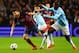 MANCHESTER, ENGLAND - FEBRUARY 18: Cesc Fabregas of Barcelona competes with Yaya Toure of Manchester City during the UEFA Champions League Round of 16 first leg match between Manchester City and Barcelona at the Etihad Stadium on February 18, 2014 in Man