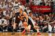MIAMI, FL - JUNE 6: Tony Parker #9 of the San Antonio Spurs drives off a screen by teammate Tiago Splitter #22 against Norris Cole #30 of the Miami Heat during Game One of the 2013 NBA Finals on June 6, 2013 at American Airlines Arena in Miami, Florida. N