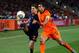 JOHANNESBURG, SOUTH AFRICA - JULY 11: Jesus Navas of Spain and Giovanni Van Bronckhorst of the Netherlands battle for the ball during the 2010 FIFA World Cup South Africa Final match between Netherlands and Spain at Soccer City Stadium on July 11, 2010 i