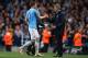MANCHESTER, ENGLAND - MAY 07: Edin Dzeko of Manchester City is congratulated by Manuel Pellegrini, manager of Manchester City as he is substituted during the Barclays Premier League match between Manchester City and Aston Villa at Etihad Stadium on May 7