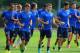 ST ALBANS, ENGLAND - AUGUST 26: Aaron Ramsey and Theo Walcott of Arsenal warm up with jack Wilshere during a training session ahead of their UEFA Champions League Play Off second leg match against Fenerbache at London Colney on August 26, 2013 in St Alba