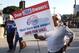 LOS ANGELES, CA - APRIL 29: A man holds a sign during a protest against racist comments made by L.A. Clippers owner Donald Sterling outside Staples Center before a playoff game on April 29, 2014 in Los Angeles, California. Clippers owner Donald Sterlin