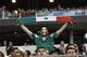 ARLINGTON, TX - MAY 31: A fan of Mexico holds the flag as his team plays Ecuador in a international friendly match at the AT&T Stadium on May 31, 2014 in Arlington, Texas. (Photo by Chris Covatta/Getty Images)