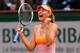 PARIS, FRANCE - JUNE 03: Maria Sharapova of Russia celebrates victory during her women's singles match against Garbine Muguruza of Spain on day ten of the French Open at Roland Garros on June 3, 2014 in Paris, France. (Photo by Clive Brunskill/Getty Ima