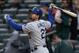 May 22, 2014; New York, NY, USA; Los Angeles Dodgers first baseman Adrian Gonzalez (23) watches his sacrifice fly that scored a run against the New York Mets during the first inning at Citi Field. Mandatory Credit: Adam Hunger-USA TODAY Sports