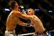 BOSTON, MA - AUGUST 17: Conor McGregor punches Max Holloway in their featherweight bout at TD Garden on August 17, 2013 in Boston, Massachusetts. (Photo by Jared Wickerham/Getty Images)