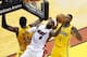 May 30, 2014; Miami, FL, USA; Miami Heat forward LeBron James (6) shoots between Indiana Pacers center Roy Hibbert (55) and guard Lance Stephenson (1) during the first half in game six of the Eastern Conference Finals of the 2014 NBA Playoffs at American