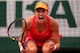 PARIS, FRANCE - JUNE 03: Eugenie Bouchard of Canada celebrates match point during her women's singles quarter-final match against Carla Suarez Navarro of Spain on day ten of the French Open at Roland Garros on June 3, 2014 in Paris, France. (Photo by Cl