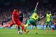 NORWICH, ENGLAND - APRIL 20: Luis Suarez of Liverpool is challenged by Bradley Johnson of Norwich City during the Barclays Premier League match between Norwich City and Liverpool at Carrow Road on April 20, 2014 in Norwich, England. (Photo by Jamie McDo