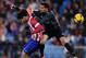 MADRID, SPAIN - NOVEMBER 23: Diego Costa (L) of Club Atletico de Madrid is tackled by Miguel Angel Moya of Getafe CF during the La Liga match between Club Atletico de Madrid and Getafe CF at Vicente Calderon Stadium on November 23, 2013 in Madrid, Spain.