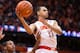 SYRACUSE, NY - FEBRUARY 9: Tyler Ennis #11 of the Syracuse Orange makes a jumping pass while being defended by Jaron Blossomgame #5 of the Clemson Tigers during the second half on February 9, 2014 at The Carrier Dome in Syracuse, New York. Syracuse defe