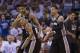 OKLAHOMA CITY, OK - May 31: Tim Duncan #21 of the San Antonio Spurs congratulates teammate Patty Mills #8 of the San Antonio Spurs during the game against the Oklahoma City Thunder in Game 6 of the Western Conference Finals during the 2014 NBA Playoffs a