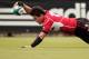 TOKYO, JAPAN - JUNE 10: Ayumu Gorumaru of Japan goes over for a try during the IRB Pacific Nations Cup match between Japan and Tonga at Prince Chichibu Memorial Stadium on June 10, 2012 in Tokyo, Japan. (Photo by Adam Pretty/Getty Images)