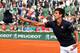PARIS, FRANCE - JUNE 03: Novak Djokovic of Serbia throws a shirt into the crowd as he celebrates victory in his men's singles match against Milos Raonic of Canada on day ten of the French Open at Roland Garros on June 3, 2014 in Paris, France. (Photo by