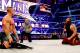 John Cena resists hitting Bray Wyatt with a chair.