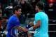 PARIS, FRANCE - JUNE 04: Rafael Nadal of Spain shakes hands with David Ferrer of Spain at the net after their men's singles quarter-final match on day eleven of the French Open at Roland Garros on June 4, 2014 in Paris, France. (Photo by Dan Istitene/Ge