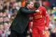 LIVERPOOL, ENGLAND - DECEMBER 21: Liverpool manager Brendan Rodgers speaks with Joe Allen during the Barclays Premier League match between Liverpool and Cardiff City at Anfield at Anfield on December 21, 2013 in Liverpool, England. (Photo by Clive Brun