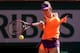 PARIS, FRANCE - JUNE 05: Simona Halep of Romania returns a shot during her women's singles match against Andrea Petkovic of Germany on day twelve of the French Open at Roland Garros on June 5, 2014 in Paris, France. (Photo by Matthew Stockman/Getty Imag