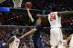 Mar 27, 2014; Memphis, TN, USA; UCLA Bruins guard Zach LaVine (14) lays the ball up ahead of Florida Gators forward Casey Prather (24) during the first half in the semifinals of the south regional of the 2014 NCAA Mens Basketball Championship tournament a