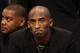 PHOENIX, AZ - JANUARY 15: Kobe Bryant #24 of the Los Angeles Lakers watches from the bench during the NBA game against the Phoenix Suns at US Airways Center on January 15, 2014 in Phoenix, Arizona. NOTE TO USER: User expressly acknowledges and agrees th